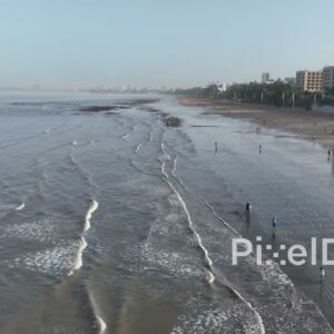 PD0508 - Aerial Flight Along a City Beach During Low Tide