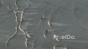 PD0504 - Minimalist Aerial of Fishermen and Wave Patterns in the Sea