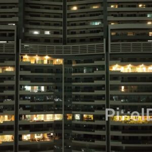 PD0543 - A Glimpse into Urban Living: High-Rise Apartment Building at Night