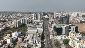 PD0555 - Urban Transformation: Flying Along a Major Road in Pune