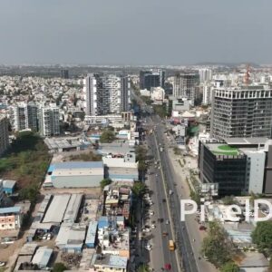 PD0555 - Urban Transformation: Flying Along a Major Road in Pune