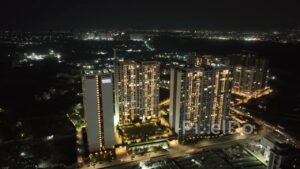 PD0539 - Aerial Orbit of the Illuminated Panchshil Towers in Pune at Night