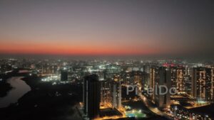PD0570 - Illuminated High-Rise Residences Against a Sunset Afterglow