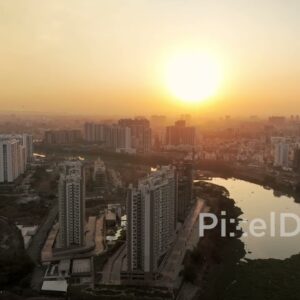 PD0566 - Golden Sunset Over a Riverside Residential Township in Pune