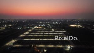 PD0618 - Future Homes: An Aerial of an Illuminated Housing Subdivision at Night