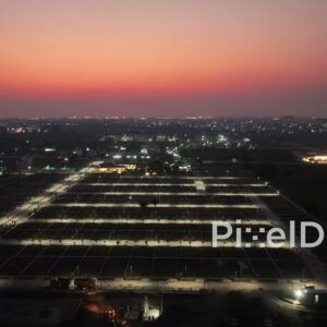 PD0618 - Future Homes: An Aerial of an Illuminated Housing Subdivision at Night