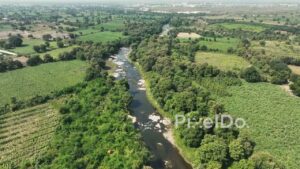 PD0614 - Aerial View of a Winding River Through a Lush Agricultural Valley