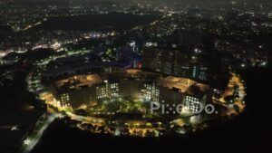 PD0630 - Illuminated Corporate Campus: An Aerial Orbit of SP Infocity, Pune at Night