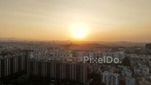 PD0629 - Hazy Golden Sunset Over a Modern Cityscape in Pune