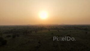 PD0626 - Hazy Golden Sunset Over a Vast Rural Landscape