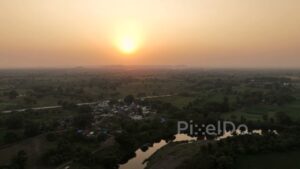 PD0625 - Golden Sunset Over a Rural Riverside Village