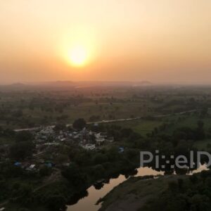 PD0625 - Golden Sunset Over a Rural Riverside Village