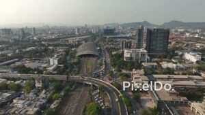 PD0690 - Forward Drone Flight Towards the Turbhe Train Station and Urban Cityscape