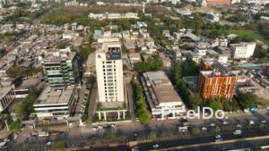 PD0689 - Aerial Orbit of a Marriott Hotel in a Busy Urban Cityscape