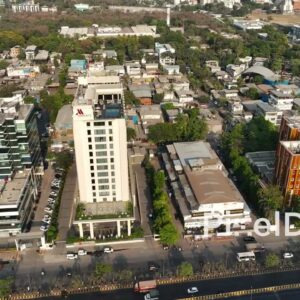 PD0689 - Aerial Orbit of a Marriott Hotel in a Busy Urban Cityscape