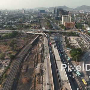 PD0687 - Commuter Train and Highway Traffic in Navi Mumbai's Urban Landscape