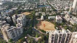 PD0682 - Aerial Orbit of a Residential Neighborhood and Sports Ground in Navi Mumbai
