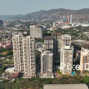 PD0681 - Sweeping Aerial of a Modern Residential Area with a Mountain Backdrop