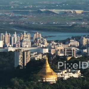 PD0729 - Aerial View Juxtaposing a Golden Pagoda and the New Navi Mumbai Airport Construction