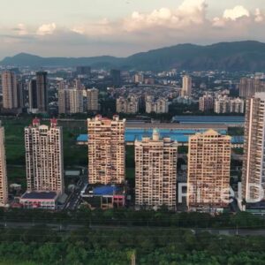 PD0728 - Sweeping Drone Shot of Palm Beach Road's Skyline with a Mountain Backdrop