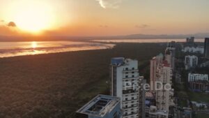 PD0726 - Cinematic Aerial Pan from a Golden Sunset to a Modern Coastal Skyline