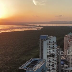 PD0726 - Cinematic Aerial Pan from a Golden Sunset to a Modern Coastal Skyline