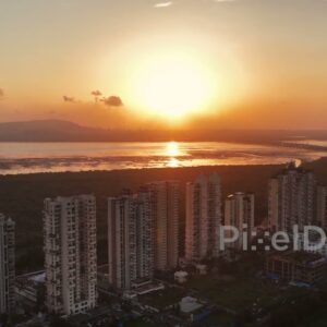 PD0725 - Dramatic Golden Sunset over a Coastal City's Residential Skyline