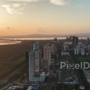 PD0723 - Sweeping Aerial of Palm Beach Road and a Coastal Metropolis at Sunset