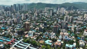 PD0103 - Aerial View of Mumbai's Mulund Suburb with its Railway Station and Green Hills