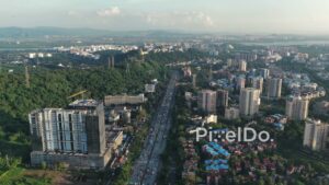 PD0714 - Forward Drone Flight Over the Panvel Highway in a Hilly Urban Landscape