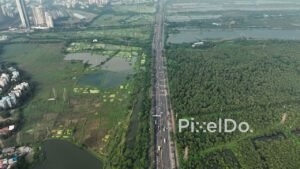 PD0123 - Aerial View of Mumbai Highway Dividing Mangrove Forest and Urban Landscape