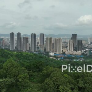 PD0120 - Aerial View of Mumbai's Urban Skyline Next to a Lush Green Forest
