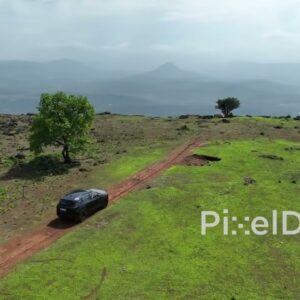 PD0117 - Aerial View of SUV Parked at a Scenic Cliffside Viewpoint in the Mountains