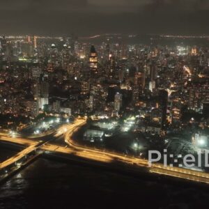 PD0067 - Aerial View of the Illuminated Mumbai Coastal Road and Skyline at Night