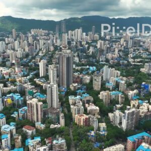 PD0113 - Aerial View of a Mumbai Suburb Nestled Against the Hills of a National Park