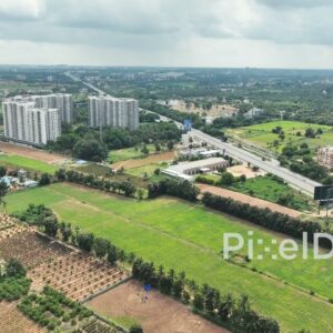 PD0148 - Aerial View of Urban Sprawl: Highway and High-Rises Next to Farmland in Bengaluru