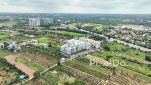 PD0147 - Aerial View of a Modern Apartment Complex Amidst Farmland on Bengaluru's Outskirts