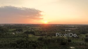 PD0189 - Aerial View of a Golden Sunset Over a Lush Rural Landscape in India