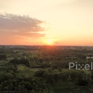 PD0189 - Aerial View of a Golden Sunset Over a Lush Rural Landscape in India