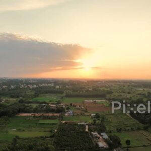 PD0188 - Aerial View of a Golden Sunset Over a Lush Rural Landscape in India