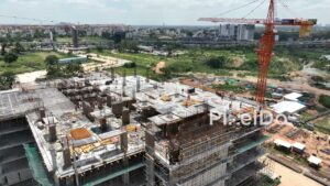 PD0178 - Aerial View of a High-Rise Building Construction Site with Workers and Cranes
