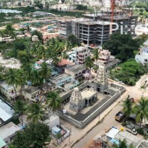 PD0176 - Aerial View of a Traditional Temple Amidst Modern Urban Development