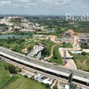 PD0171 - Aerial View of Business Park Construction Along a Highway in Bengaluru