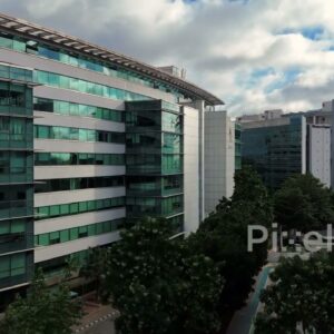 PD0223 - Aerial Reveal of a Modern Office Building in a Green Corporate Campus