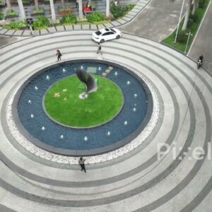 PD0224 - Aerial View of a Modern Roundabout with a Central Fountain and Sculpture