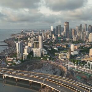 PD0265 - Aerial View of Mumbai's Coastal Road Interchange and Worli Skyline at Sunset
