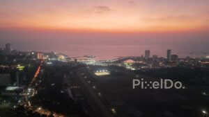 PD0255 - Aerial View of Mumbai's Illuminated Coastal Road Interchange at Twilight