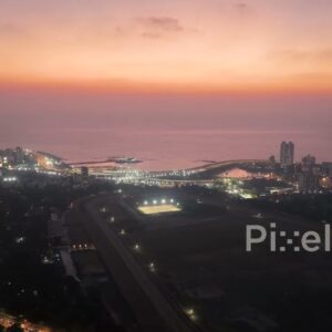 PD0255 - Aerial View of Mumbai's Illuminated Coastal Road Interchange at Twilight