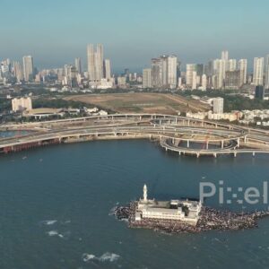 PD0250 - Aerial View of Mumbai's Iconic Haji Ali Dargah, Coastal Road, and Skyline