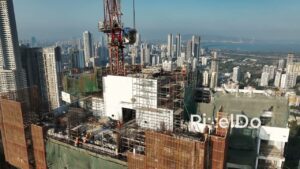 PD0247 - Aerial View of Construction Workers on a Skyscraper with the Mumbai Skyline